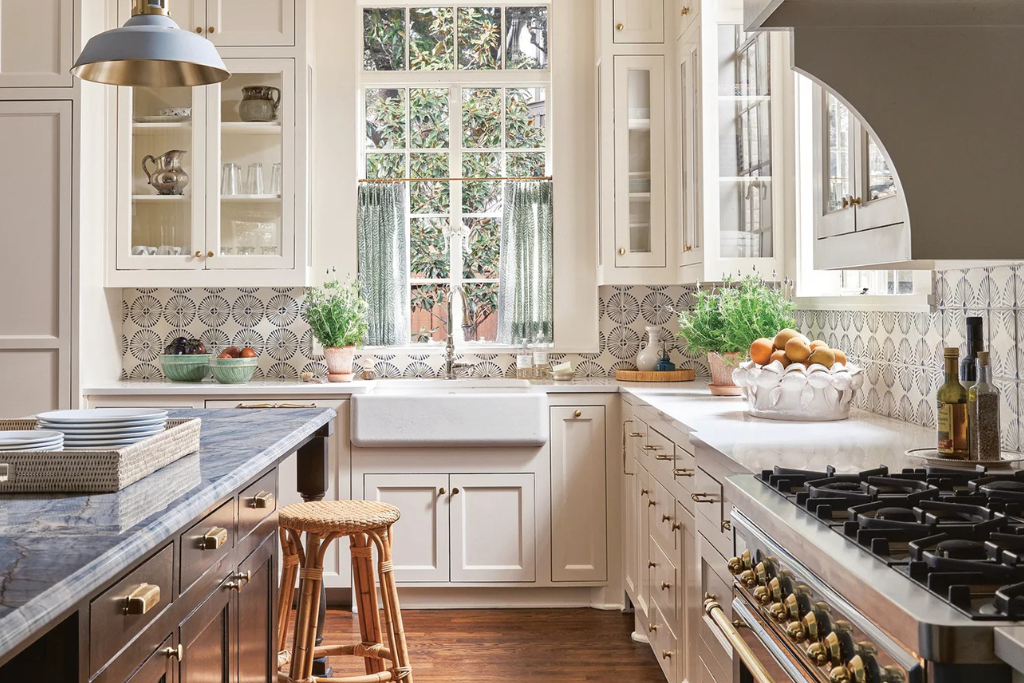 White kitchen with farmhouse sink, tile backsplash and window light
